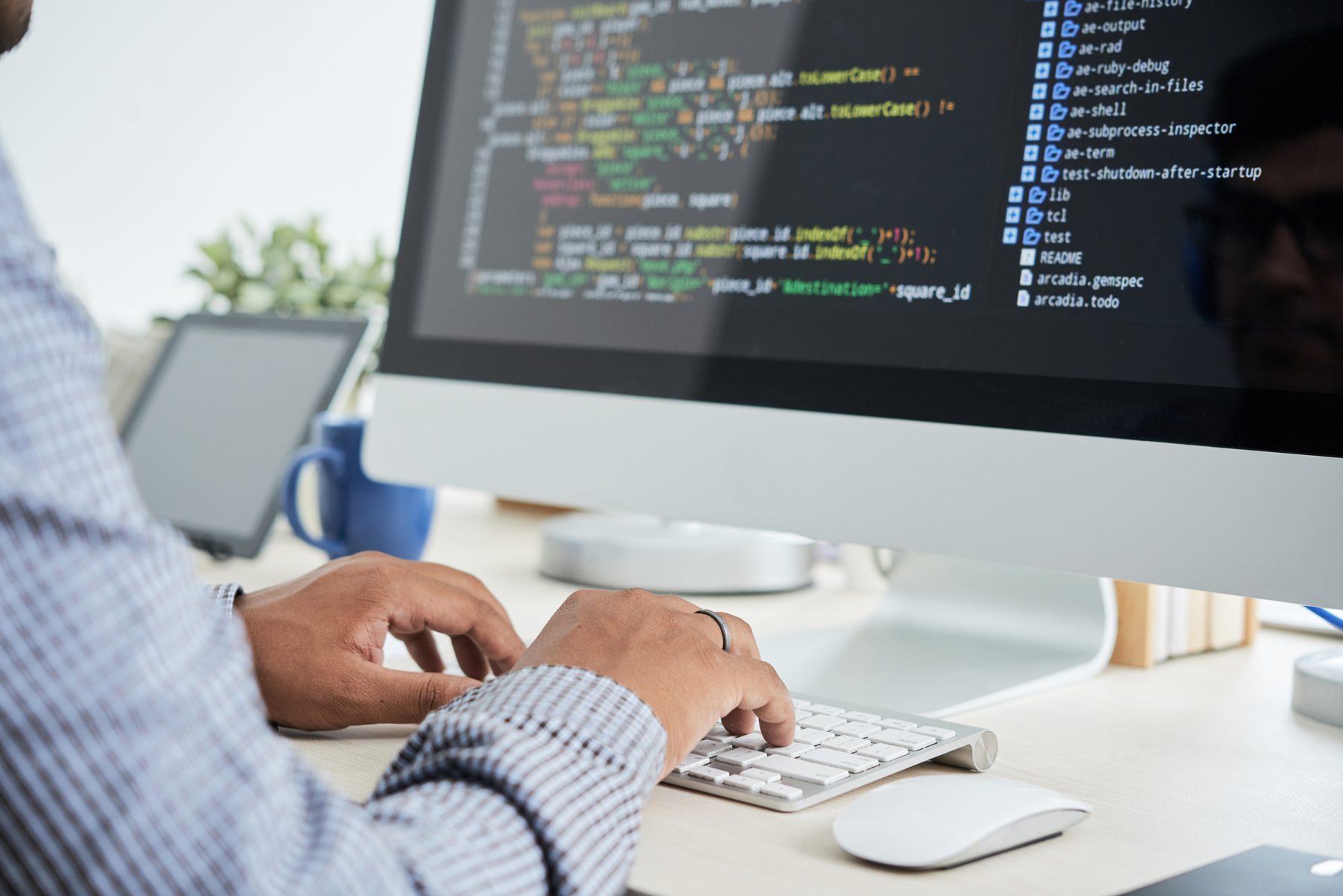 Developer writing code at a workstation